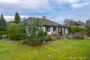 Viel Platz für die Familie! *** Wertbeständig - Bungalow mit großem Grundstück in Seevetal *** - Rückansicht mit Wintergarten